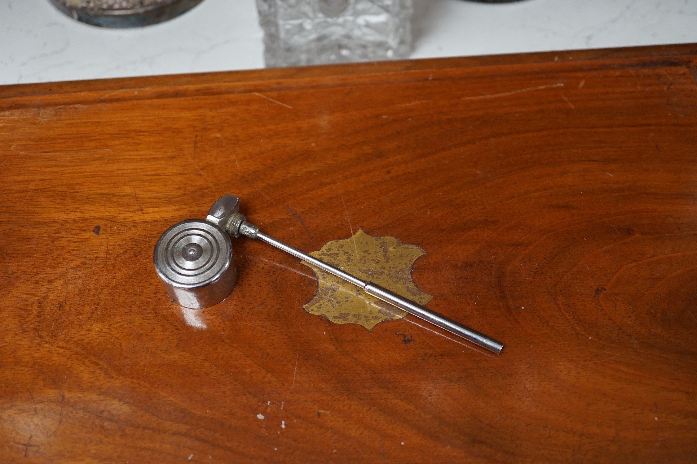 A silver mounted spirit decanter, a pair of plated candlesticks and canteen box, decanter 24 cms high
